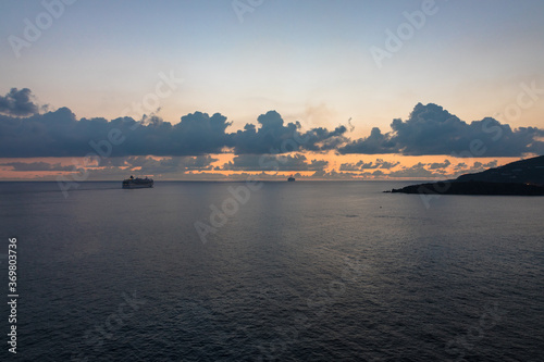 Cruise ship departing Sint Maarten at sunset, Caribbean