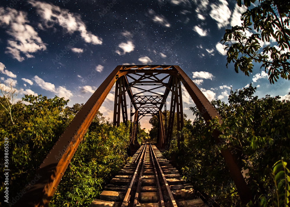 Steel bridge on the railway at moonlight - Palmital - Sussui, SP, Brazil Steel bridge on the railway at moonlight - Palmital - Sussui, SP, Brazil