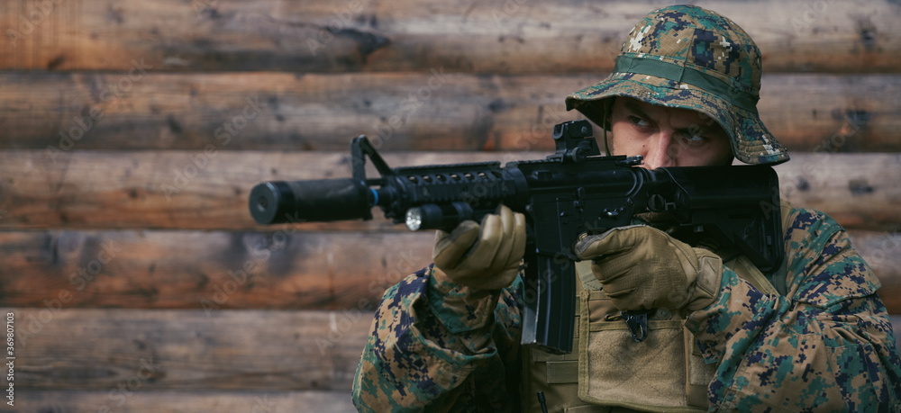 soldier in action aiming on weapon laser sight optics soldier in action aiming on weapon laser sight optics