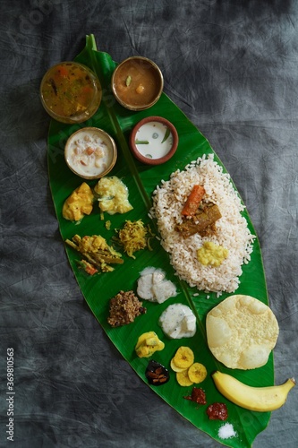 Onam feast / Kerala Ona-sadya served in banana leaf photo