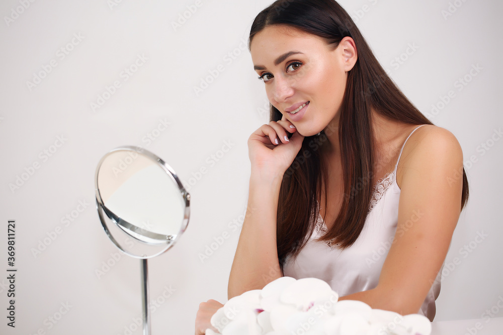 Studio portrait of a beautiful young woman with brown hair. Pretty model girl with perfectly fresh clean skin. Studio portrait of a beautiful young woman with brown hair. Pretty model girl with perfectly fresh clean skin.
