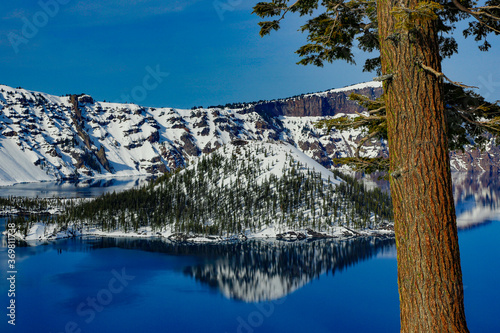 Crater Lake and wizzard island in Crater Lake National Park in the winter season with snow photo