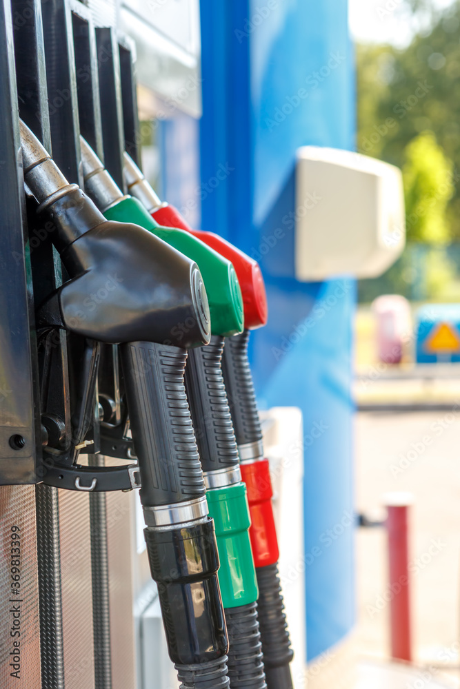 Fuel dispensing nozzles at the gas station Fuel dispensing nozzles at the gas station