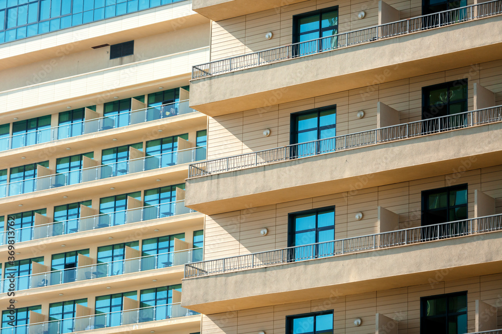 Fragment of a high-rise building with Windows and balconies Fragment of a high-rise building with Windows and balconies