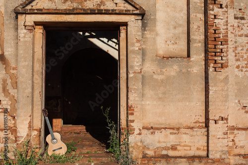Classical acoustic guitar in ruins of abandoned church at Palmital/ SP - Brazil