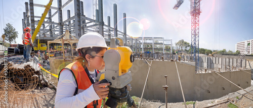 Topographical survey engineer in a building project
Panoramic view of a huge construction site
