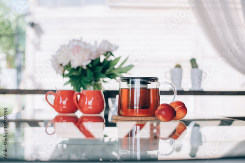 Still life of tea accessories and flowers