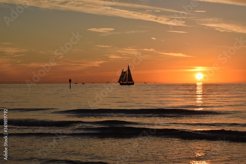 Silhouette of a sailboat against the sunset at clearwater beach