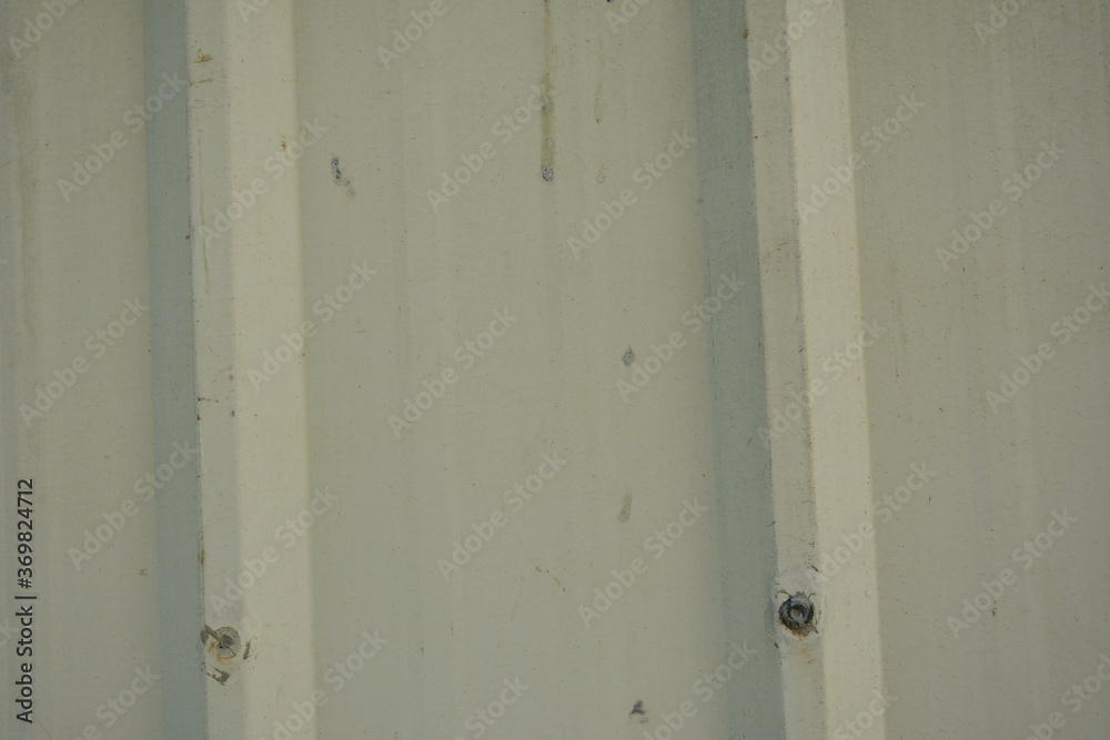 Metal sheet beige corrugated barrier use to set up a perimeter wall