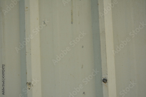 Metal sheet beige corrugated barrier use to set up a perimeter wall © walterericsy