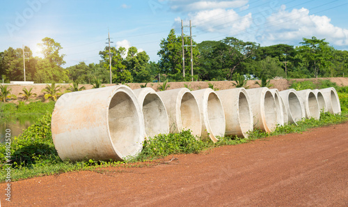 Cement pipes beside the countryside road.