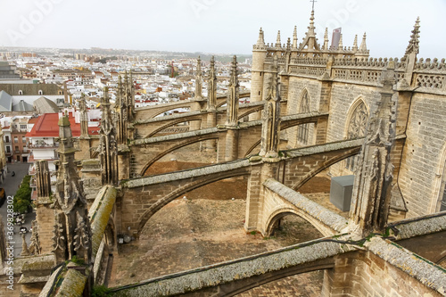 The flying buttress from the roof of the cathedral of Sevilla, Spain during winter.