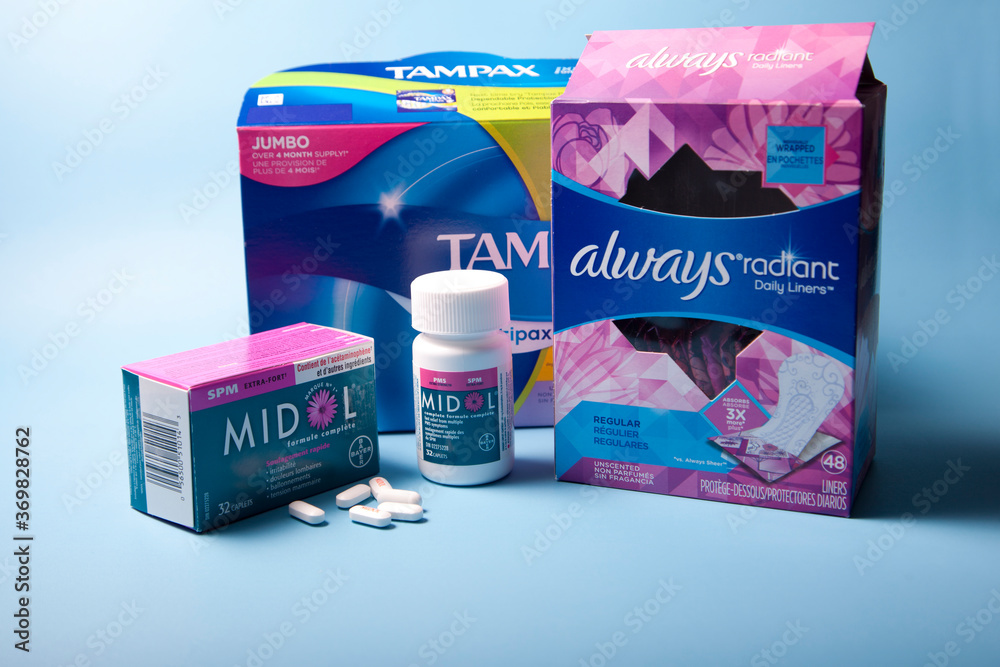 Box of Tampax tampons, Always pads and Midol for pain relief during period  foto de Stock | Adobe Stock