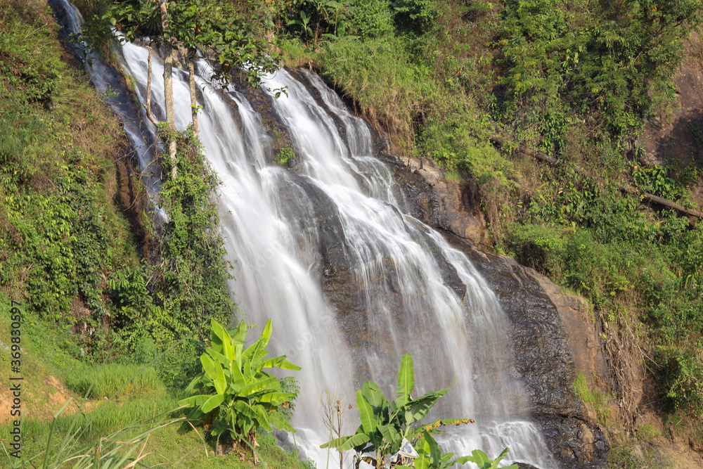 the swift water of the cikondang waterfall.