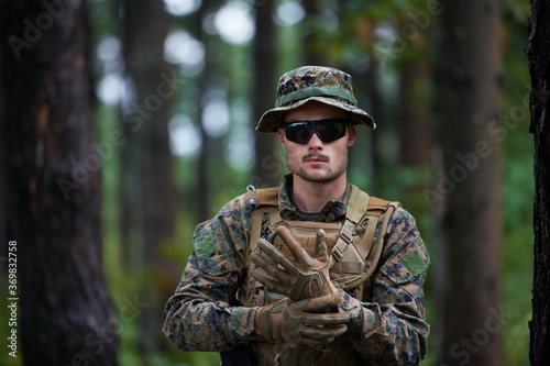 soldier preparing tactical and commpunication gear for action battle