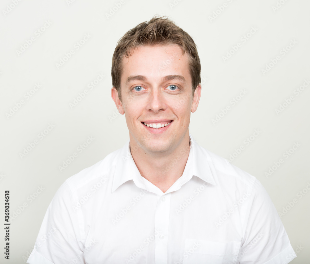 Portrait of happy handsome man against white background Portrait of happy handsome man against white background