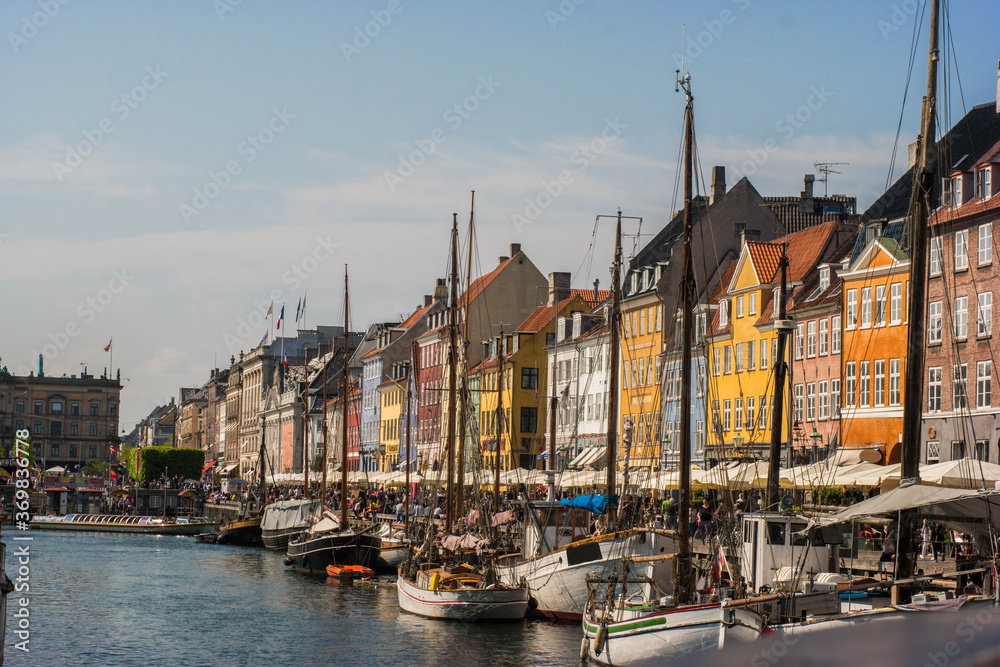 Buildings and the canal of Nyhavn district in Copenhagen, Denmark, panoramic view of Nyhavn