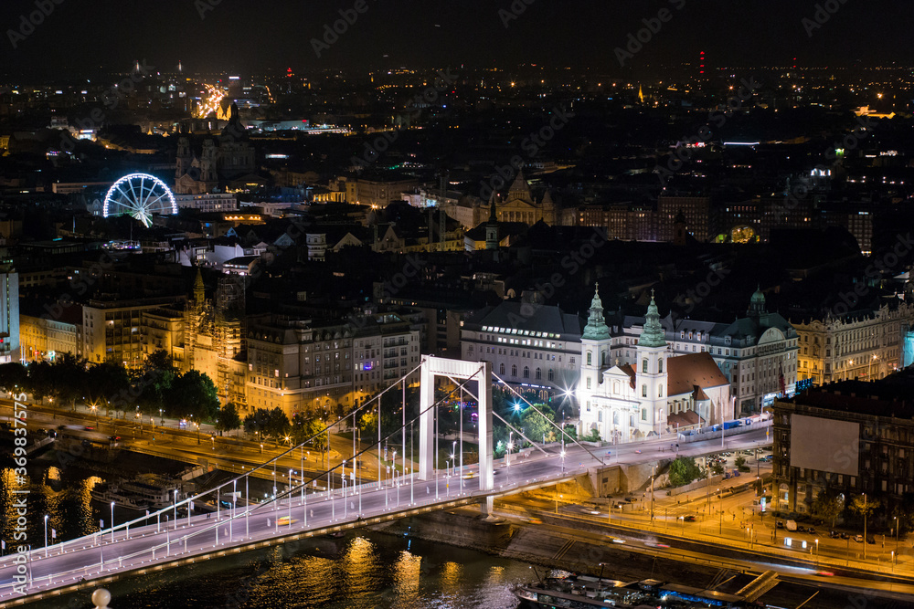 Night view of Budapest and Danube with the Elizabeth Bridge, The Main Parish Church of the Assumption in the centre of Budapest at night
