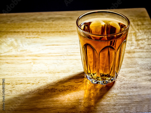 Low light photography of whiskey drinking concept