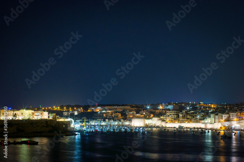 panoramic view of a bay of Valletta at night