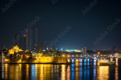 panoramic view of a bay of Valletta at night