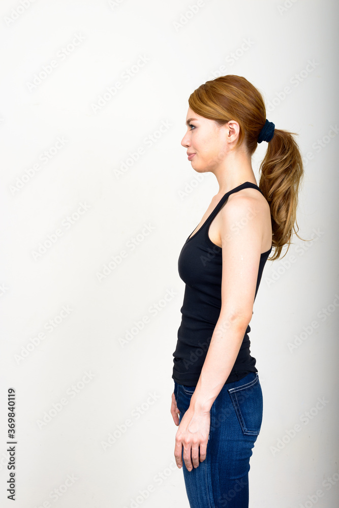 Portrait of young beautiful Asian woman against white background Portrait of young beautiful Asian woman against white background