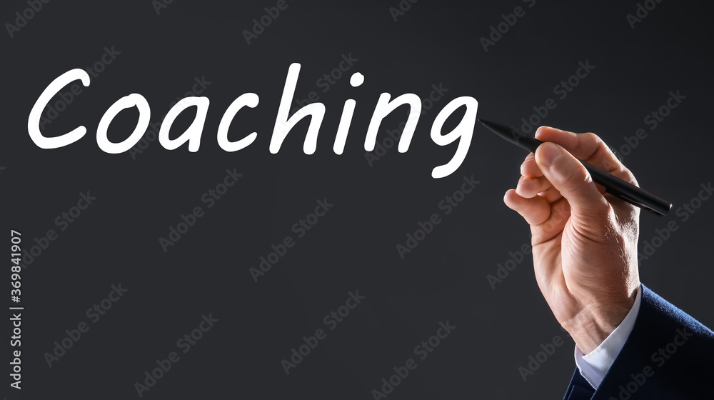 Business trainer writing word Coaching on virtual screen, closeup. Banner design Business trainer writing word Coaching on virtual screen, closeup. Banner design