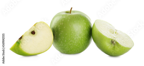 Cut and whole green apples on white background. Banner design