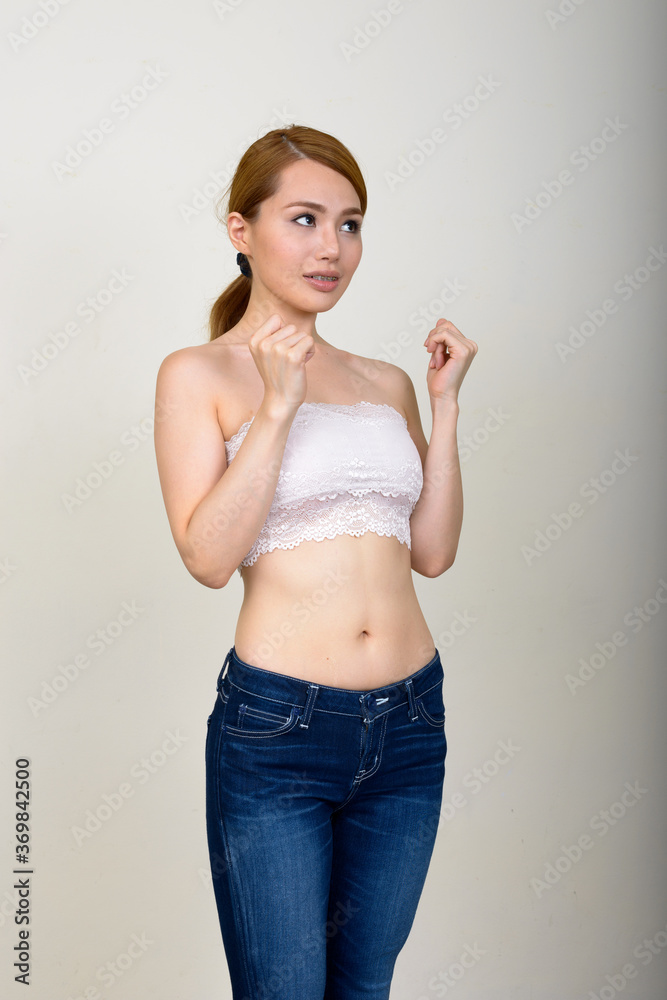 Portrait of happy young beautiful Asian woman in underwear as health concept Portrait of happy young beautiful Asian woman in underwear as health concept