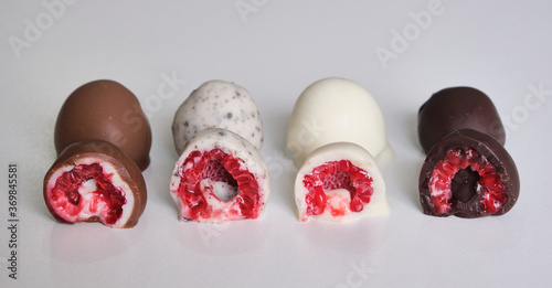 raspberries dipped or covered in mold chocolate . white chocolate, milk chocolate, dark chocolate and cookies
