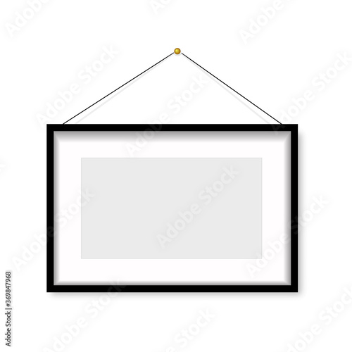 Realistic black photo frame hanging on the wall. Vector