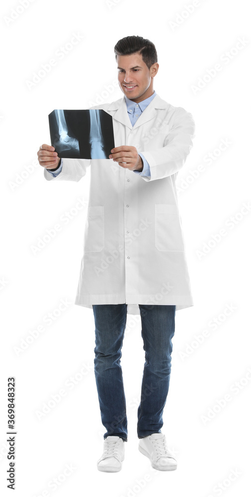 Orthopedist holding X-ray picture on white background Orthopedist holding X-ray picture on white background