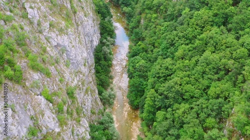 Aerial Drone Shot Of Bregava River Flowing Downstream, Bosnia and Herzegovina photo