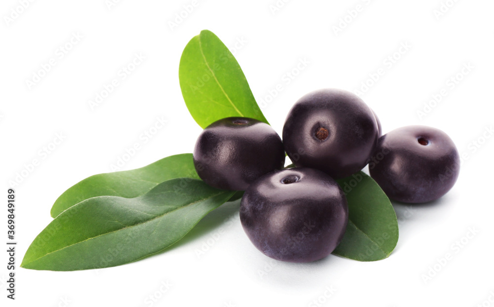 Pile of fresh acai berries with leaves isolated on white Pile of fresh acai berries with leaves isolated on white
