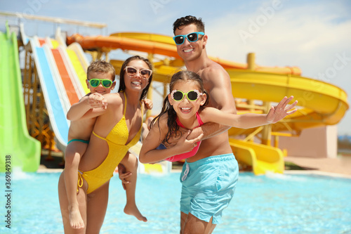 Happy family at water park. Summer vacation