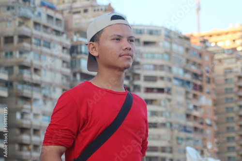 handsome young man standing on the street