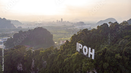 Aerial view of 'IPOH' landmark on a limestone mountain in Ipoh city, Malaysia. photo