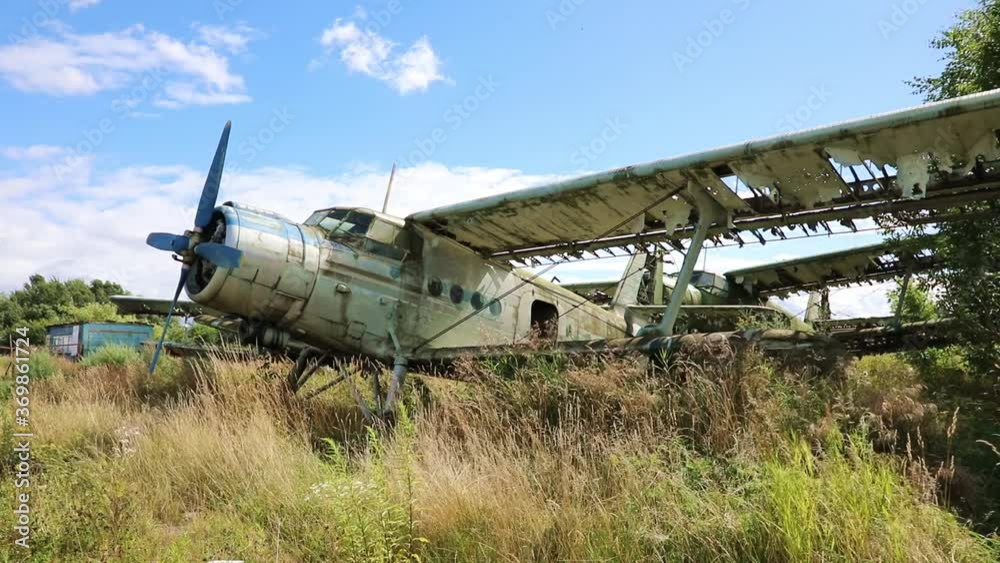 Rusty and broken planes stand in a field against a cloudy blue sky. Few destroyed abandoned planes
Rusty and broken planes stand in a field against a cloudy blue sky. Few destroyed abandoned planes