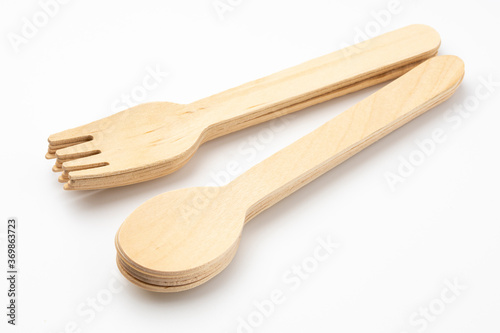 Eco natural wooden spoon and fork on white background