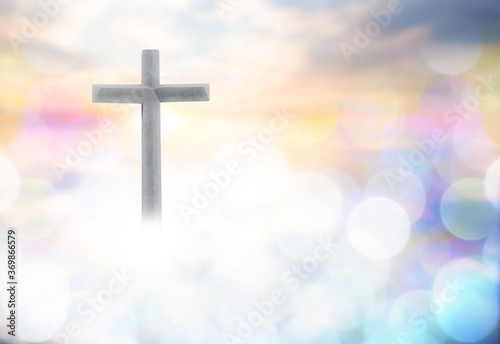 Wooden cross with bokeh blur background