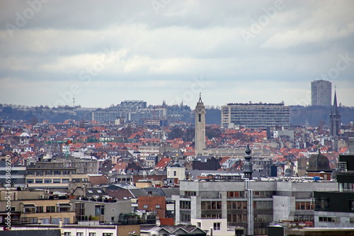 view of oldtown architecture with red tiled rooftops and modern cityscape in background  Brussels  Belgium