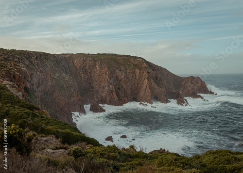 Huge cliffs beaten by the waves coming from the ocean in Australia, forming nice shapes on the walls