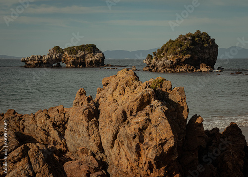 Calming landscape made of still waters and rock islands, perfectly balanced and awe-inspiring