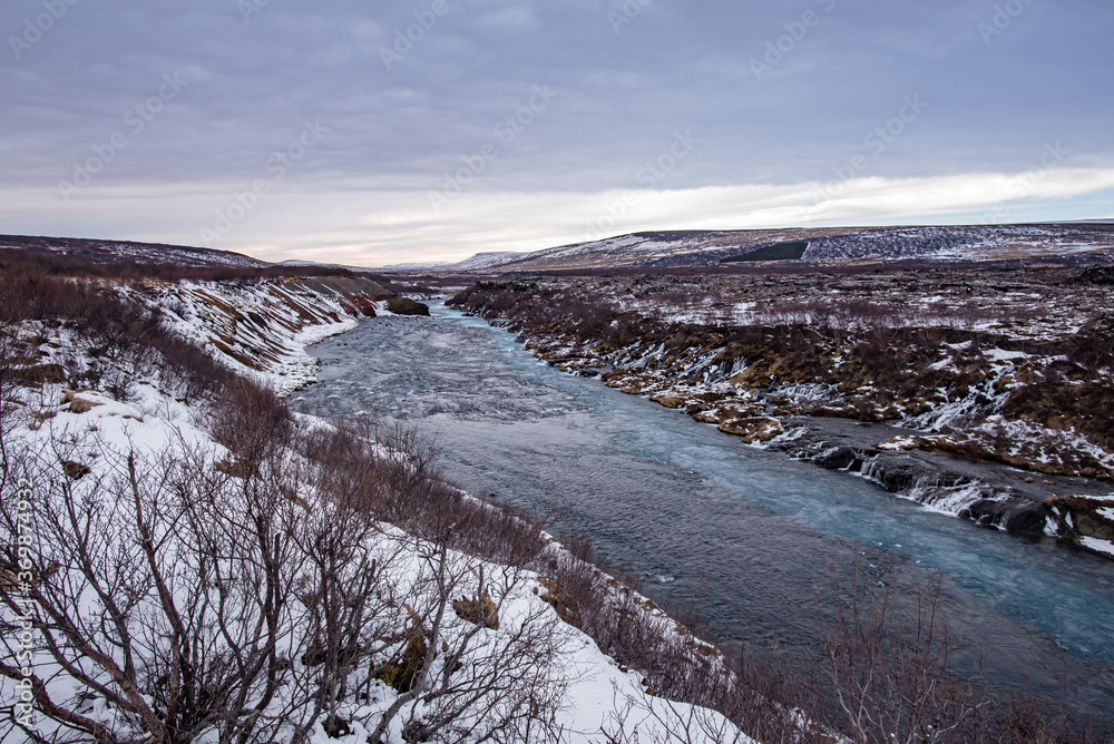 Hraunfossar Waterfall in Iceland winter 