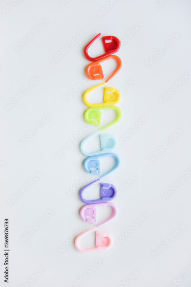 selective focus with blurry effect at colored safety pins selective focus with blurry effect at colored safety pins