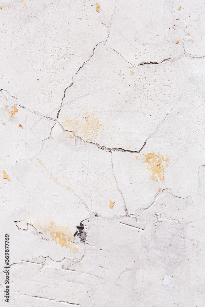 Obraz premium Concrete, weathered, worn, damaged wall paint. Rough, concrete surface with cracks and scratches. Great background or texture.