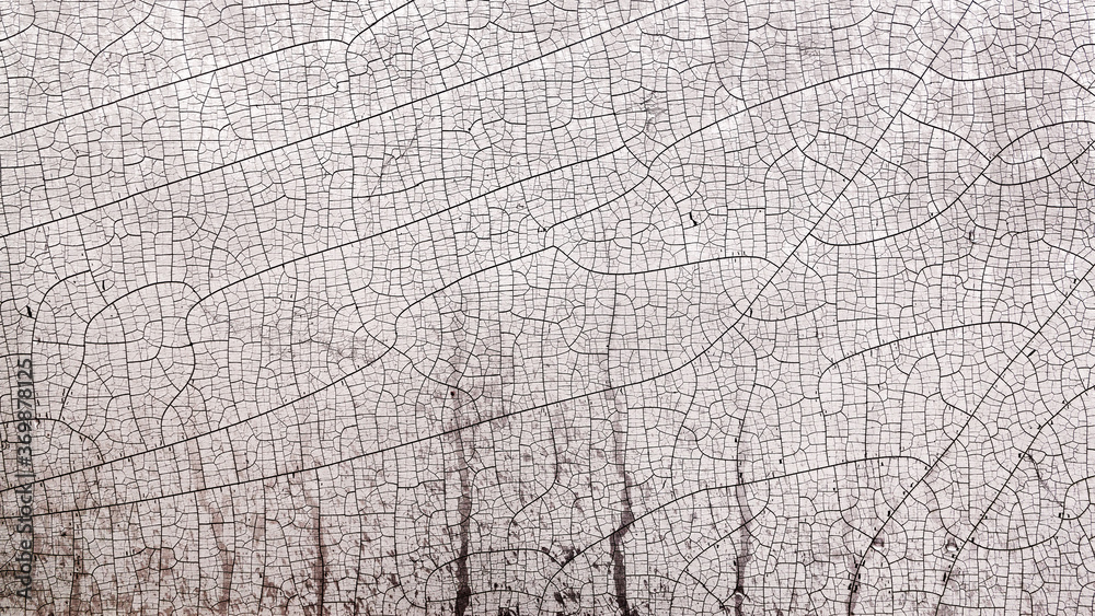 Abstract textured background covered with deep cracks