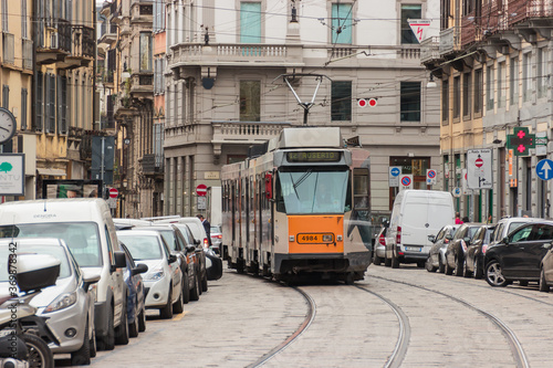 Trip tram goes along Cusani street in Milan, Italy.