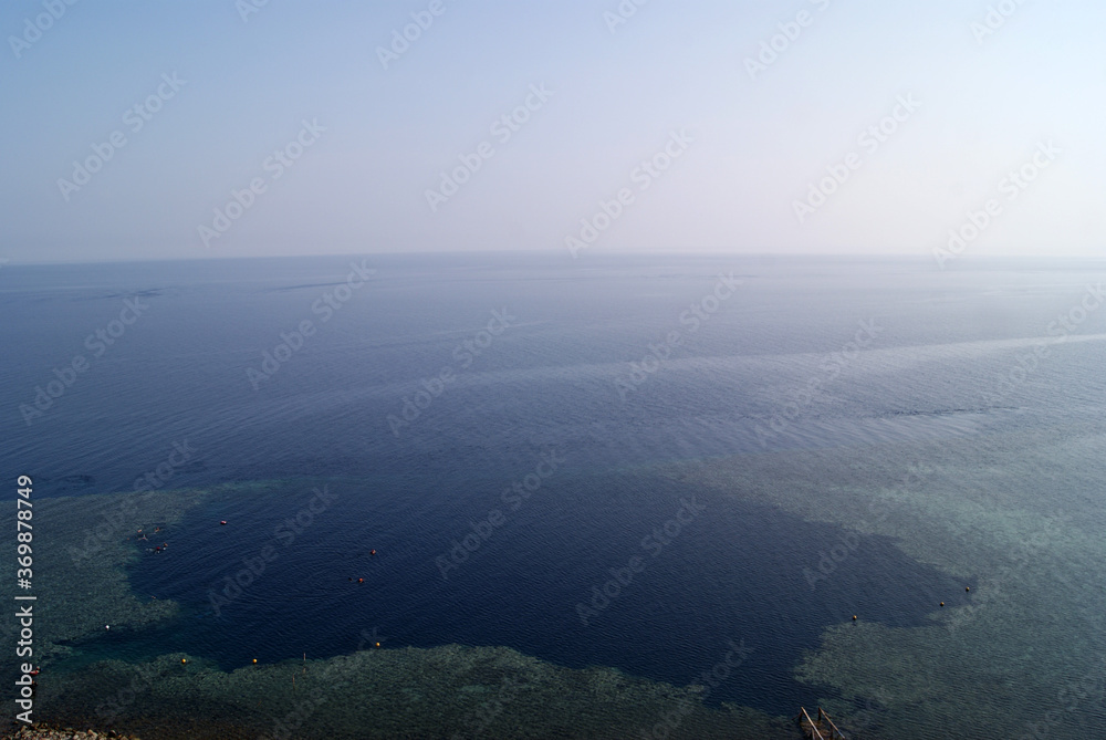 Top view of the Blue hole in Dahab (Egypt, South Sinai). Ripples on the water. Natural curvature of the horizon line