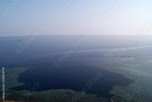 Top view of the Blue hole in Dahab (Egypt, South Sinai). Ripples on the water. Natural curvature of the horizon line